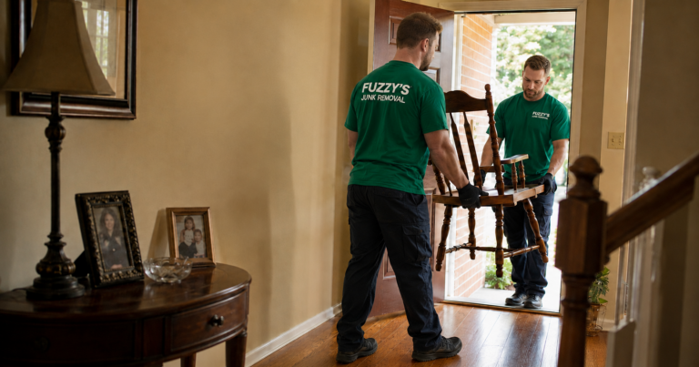 estate cleanout Memphis -- Fuzzy's crew carefully carrying furniture from a Memphis-area family home